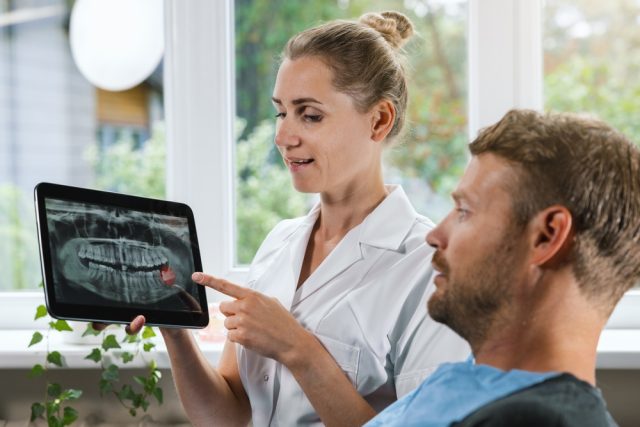 dentist talking to dentist about their x-rays
